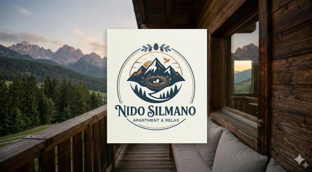 a sign for a nido summit resort on a balcony at Nido Silmano in Marilleva