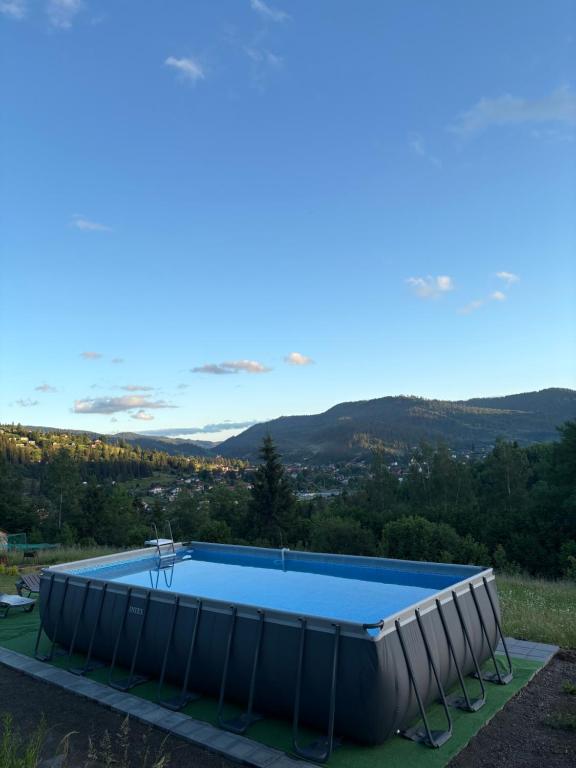 a swimming pool on top of a building with a view at Karpatski Prostory in Slavske