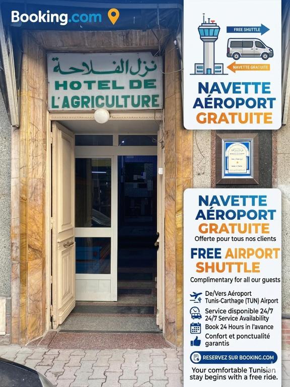 a sign in front of a building with a door at Hôtel Agriculture in Tunis