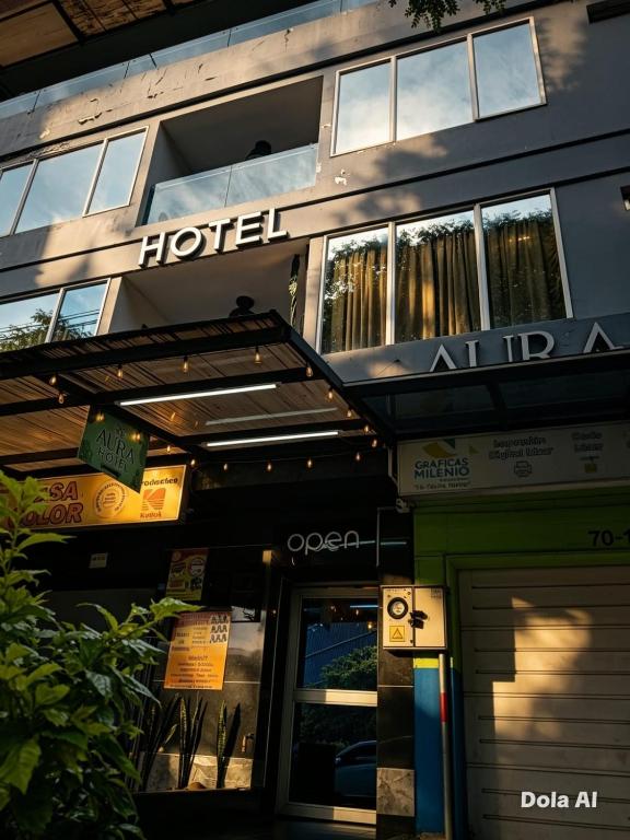 a hotel with a sign on the front of it at Hotel Aura Nutibara in Medellín
