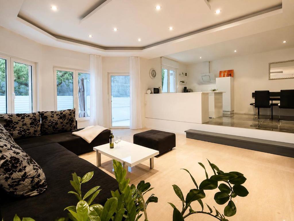 a living room with a couch and a table at Villa Apricot in Split