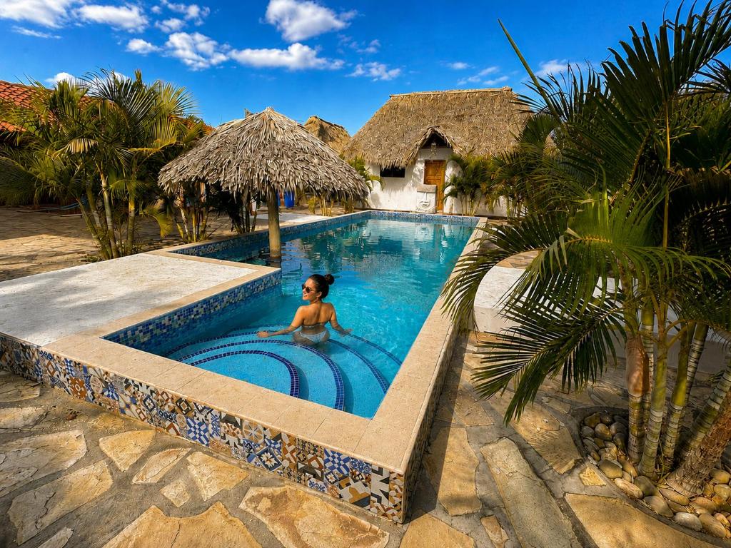 a child in a swimming pool at a resort at Aloha Popoyo in Playa Santana
