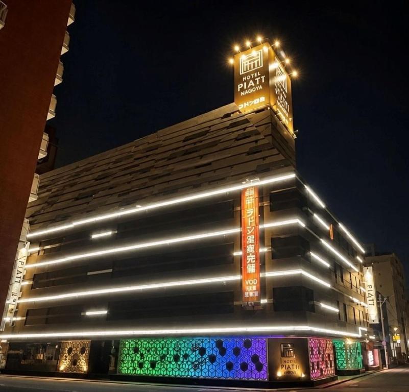 a building with lights on the side of it at Hotel Piatt Nagoya in Nagoya
