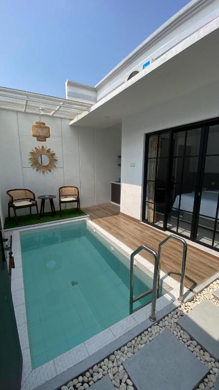 a swimming pool in the backyard of a house at Papayas 2 Villa in Yogyakarta