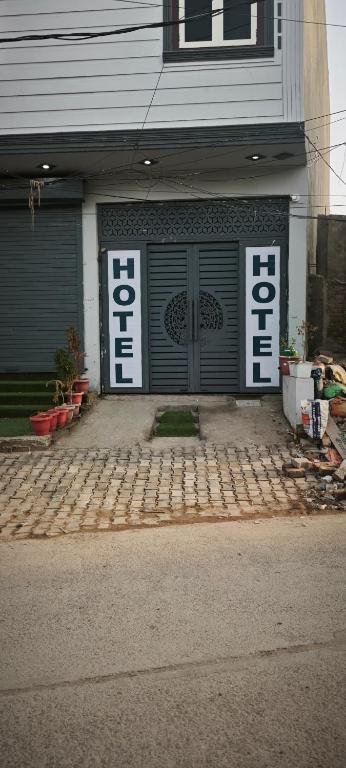 a store front with a door with the word foreclosure at Everspring Suites in Rohtak