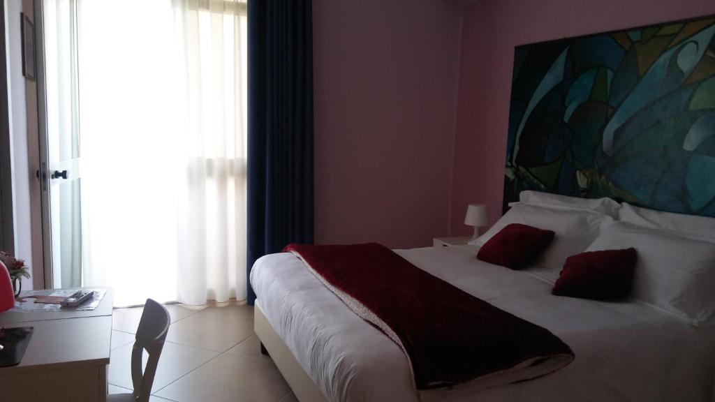 Posteľ alebo postele v izbe v ubytovaní B&b Bagheria