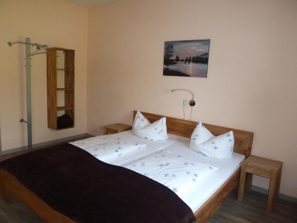 Postel nebo postele na pokoji v ubytování Hotel Wittenberg-Hotel Garni