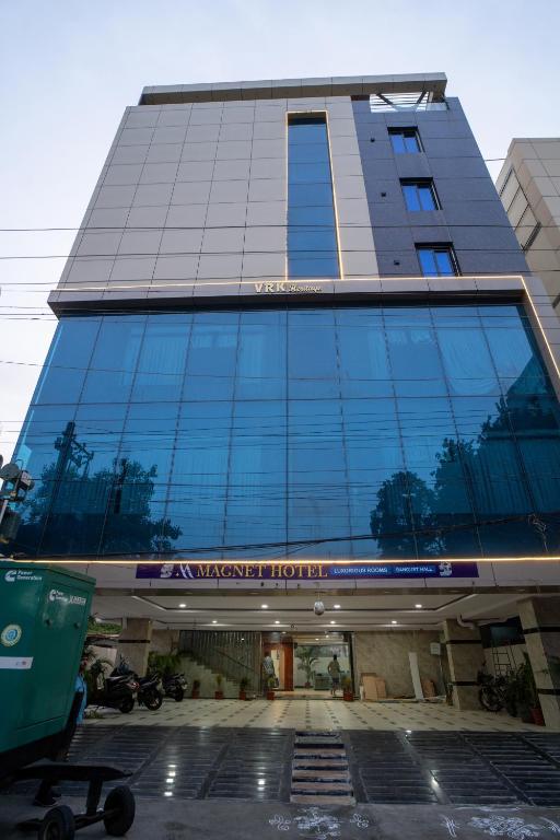 a tall building with a lot of windows at Magnet Hotel in Vijayawāda