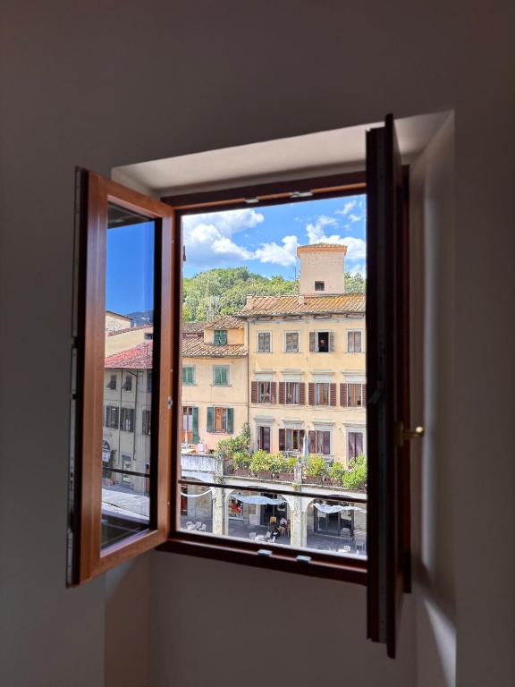 an open window with a view of a building at Casa Giulia in Figline Valdarno
