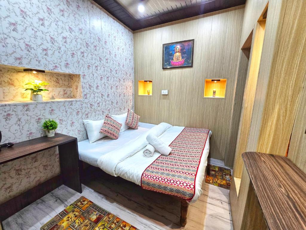 a small bedroom with a bed in a room at Zipcode Kashi in Varanasi