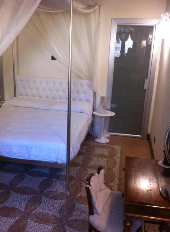Postel nebo postele na pokoji v ubytování B&B Al Convento