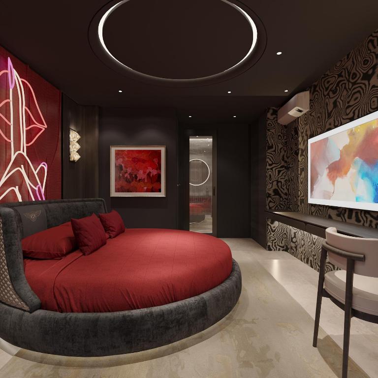 a bedroom with a large red bed in a room at Anvi Boutique Hotel Hanoi in Hanoi