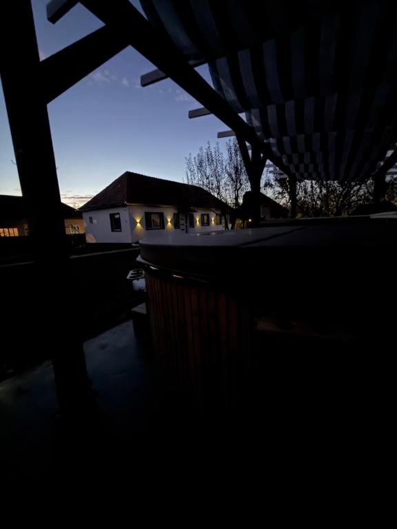 a view of a house at night with the sky at Klára House - Covasna in Covasna
