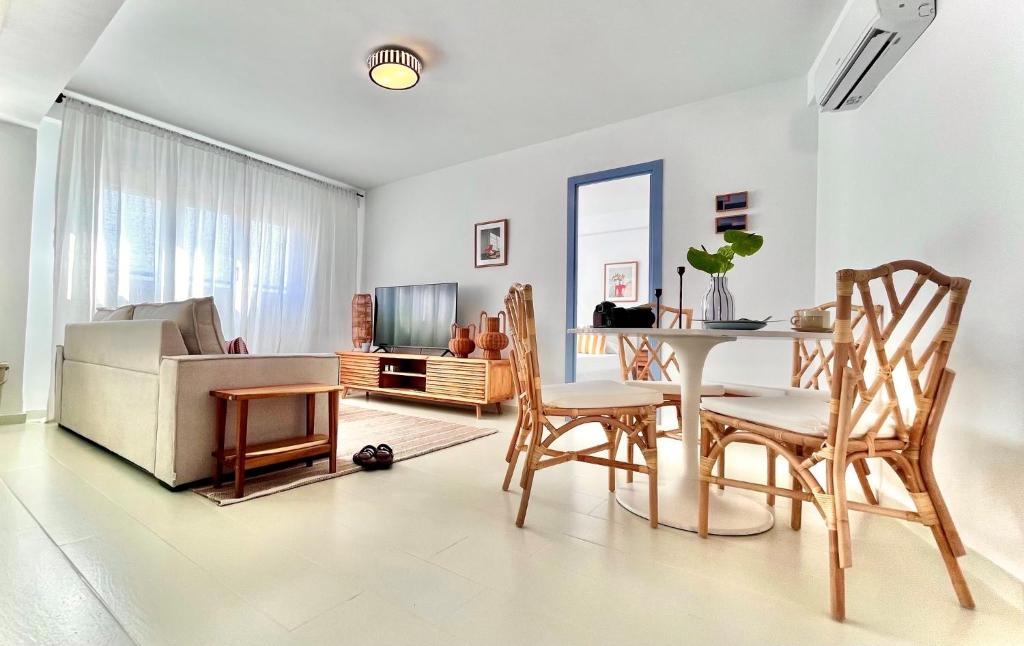 a living room with a table and a couch at casArena 1 in Las Negras