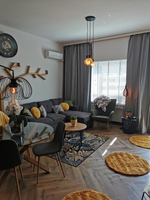 a living room with a couch and a table at Apartament Kamil Kalisz in Kalisz