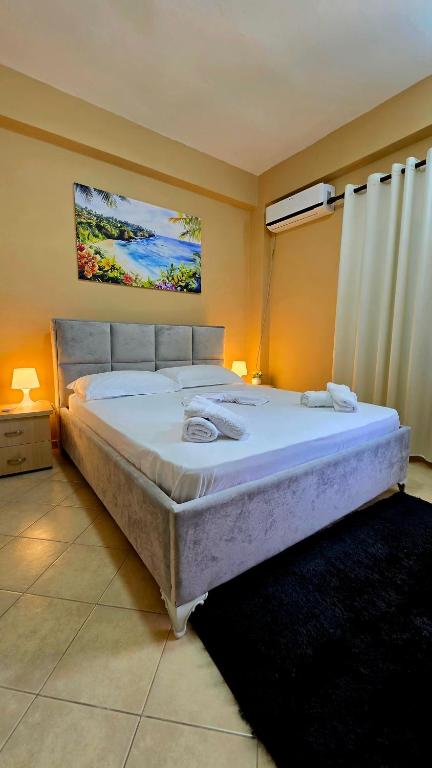 a bedroom with a large bed in a room at Villa Alvara in Vlorë