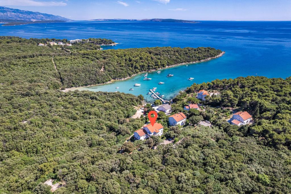 an aerial view of a island with boats in the water at Apartments Petra - 100 m from the Beach in Kampor