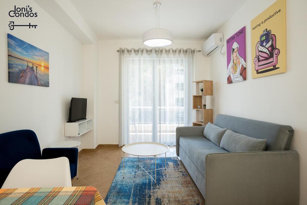 a living room with a couch and a table at Joni's Condo 10 in Golem