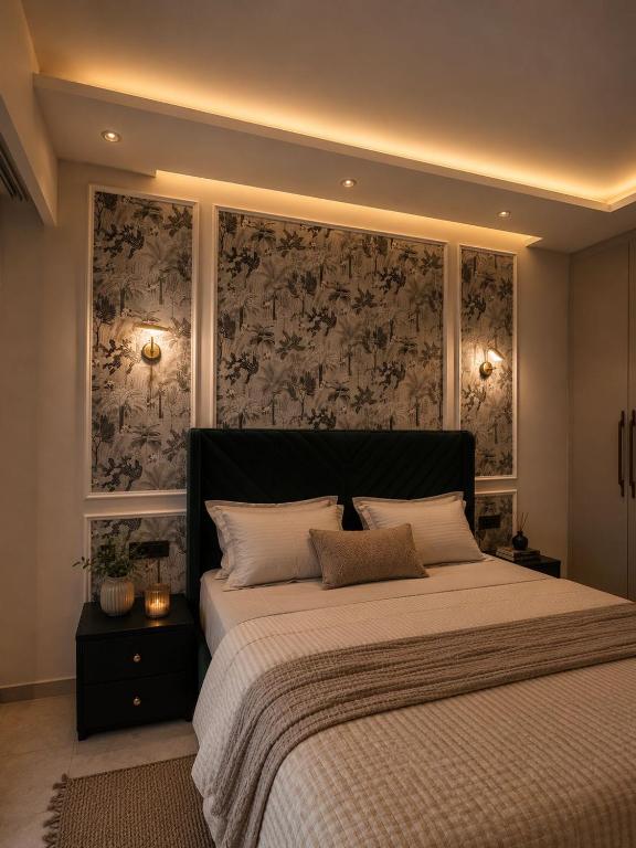 a bedroom with a large bed with white pillows at Galaxy Luxury Stay in Ghaziabad