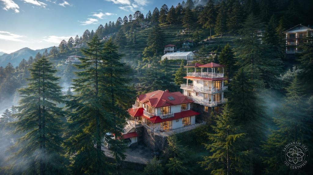 an aerial view of a house on a mountain at Vibhasa-The Scenic Solitude 6Br Villa Amidst Himalayas Near Kainchi Dham-Where BBQ and Bonfires Ignite the Adventure in Rāmgarh