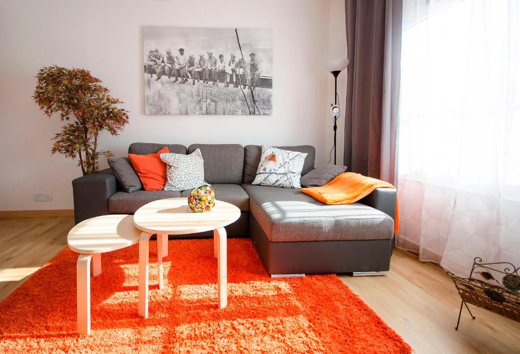 a living room with a couch and a table at Oscar Apartments Estación in Sitges
