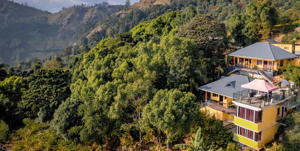 an aerial view of a house on a mountain at Greenleaf Holidays in Munnar
