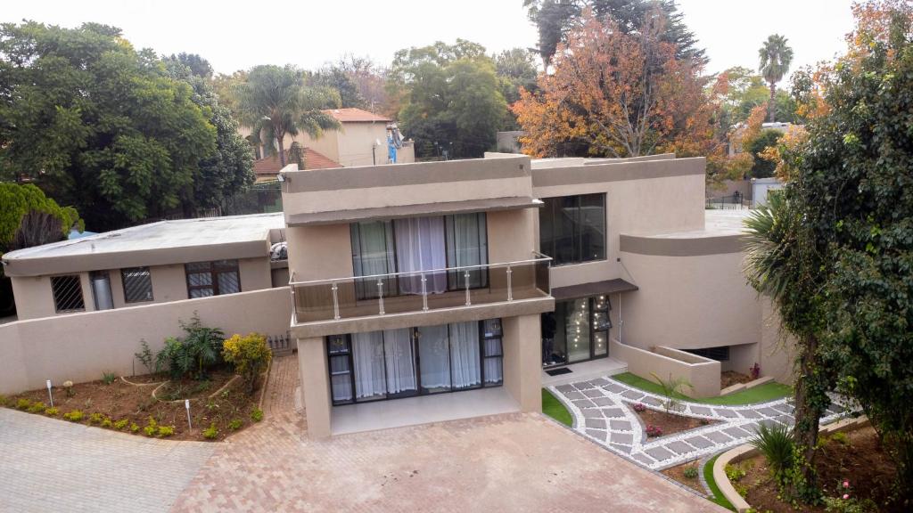 an aerial view of a house with trees at 157 on North-Sandton in Johannesburg