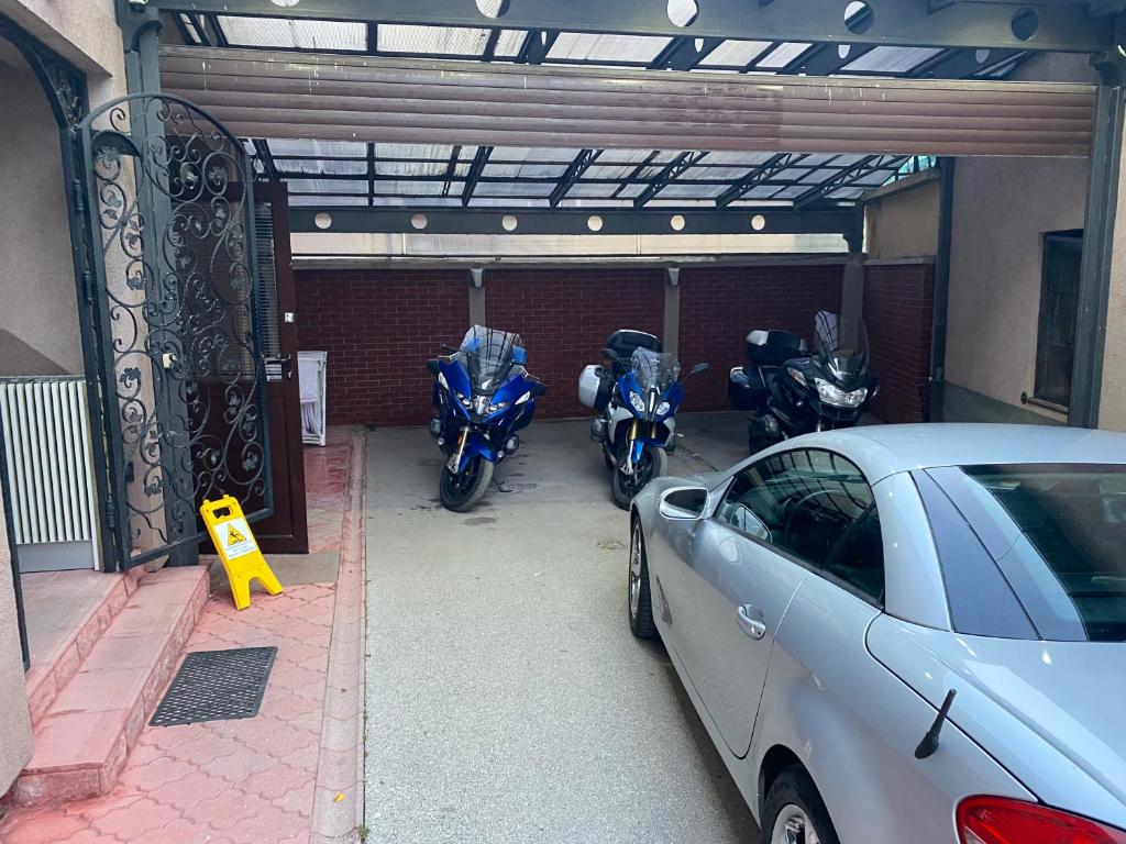 a group of motorcycles parked in a garage at Guest house DON-lux in Pljevlja