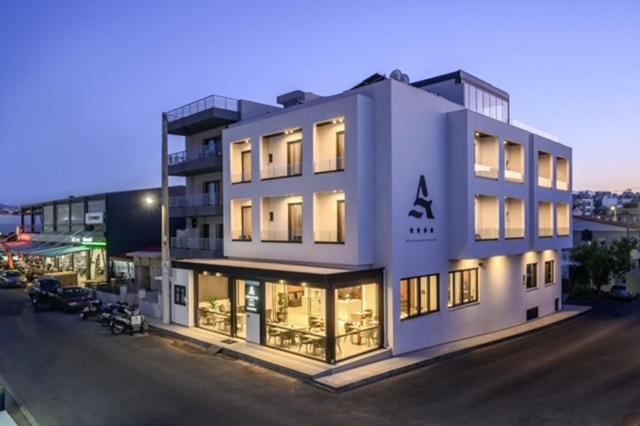a large white building with a lot of windows at Anesea City in Heraklion