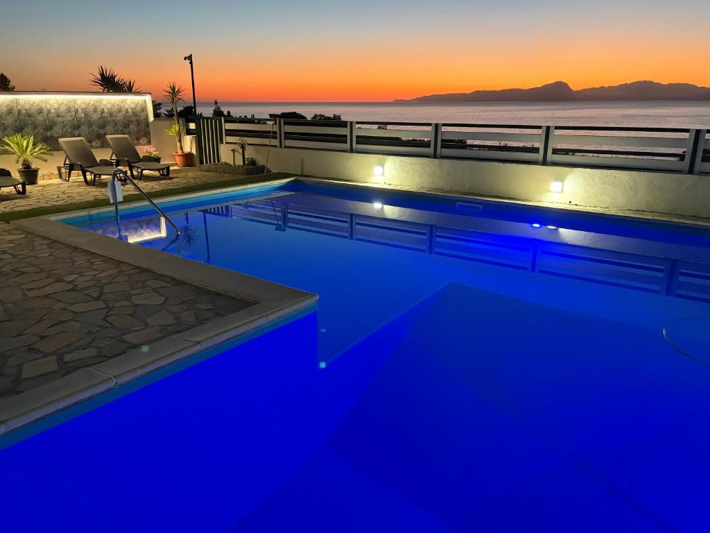 a swimming pool with blue lights on top of a building at Villa Max in San Nicola Arcella