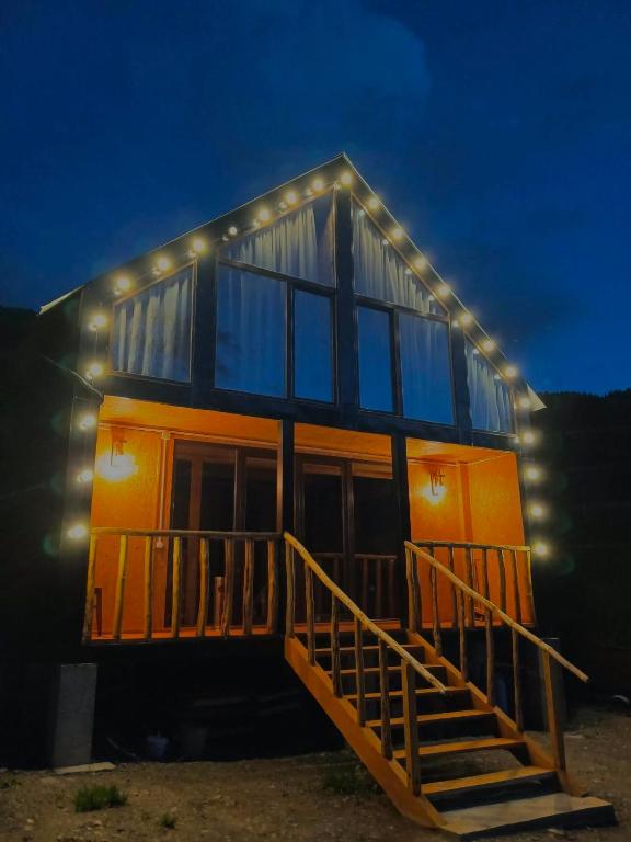 a house with lights on the side of it at Tsiskari in Tsaldashi