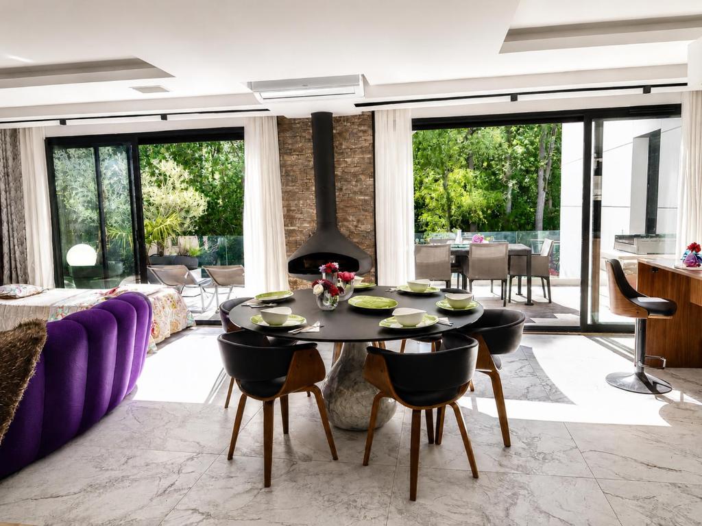 a living room with a table and a couch at Contemporary villa between Paris and Disneyland in Champs-sur-Marne