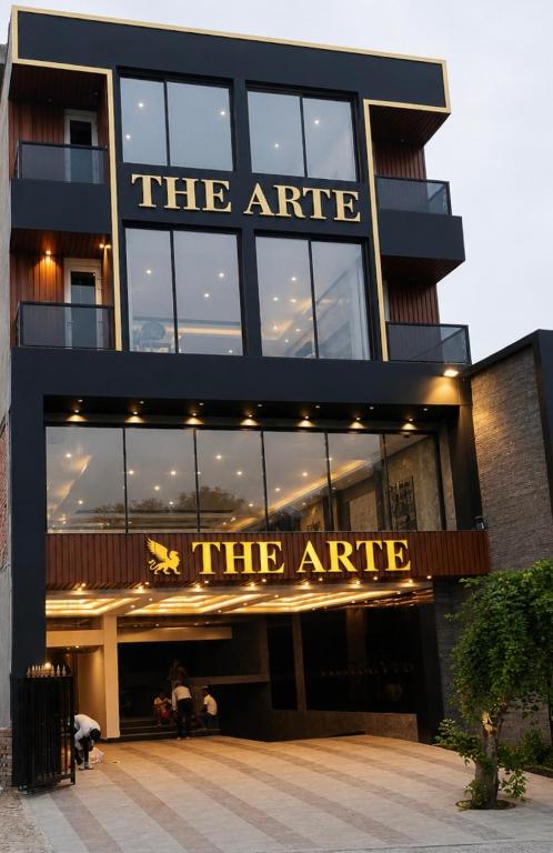 a large building with a sign that reads theire at The Arte in Rohtak