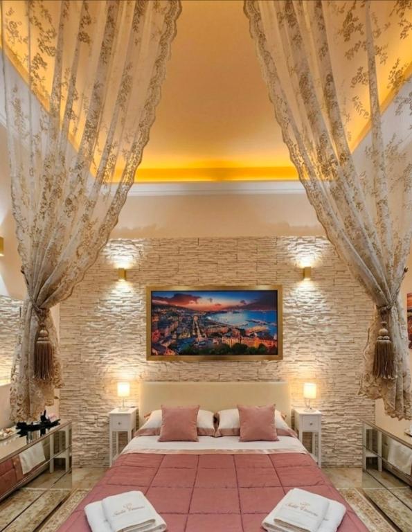 a bedroom with a large bed in a room at DREAM HOUSE in Naples
