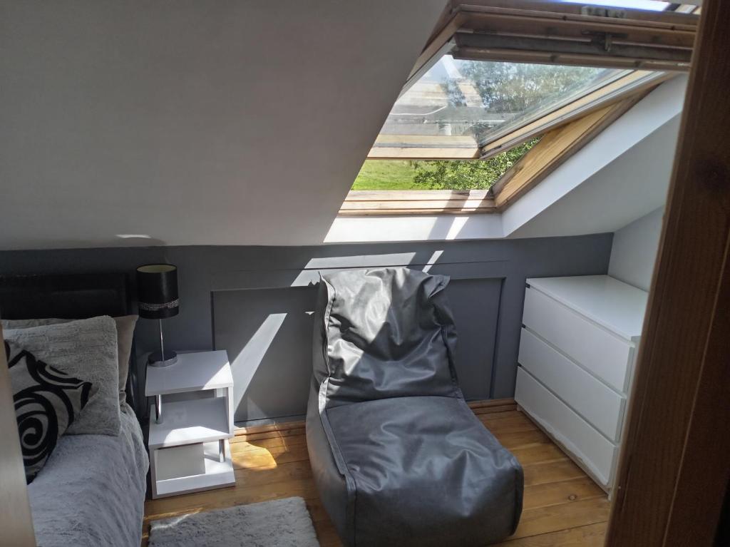 a small bedroom with a bed and a window at Strawberry dream 2 in Newcastle upon Tyne
