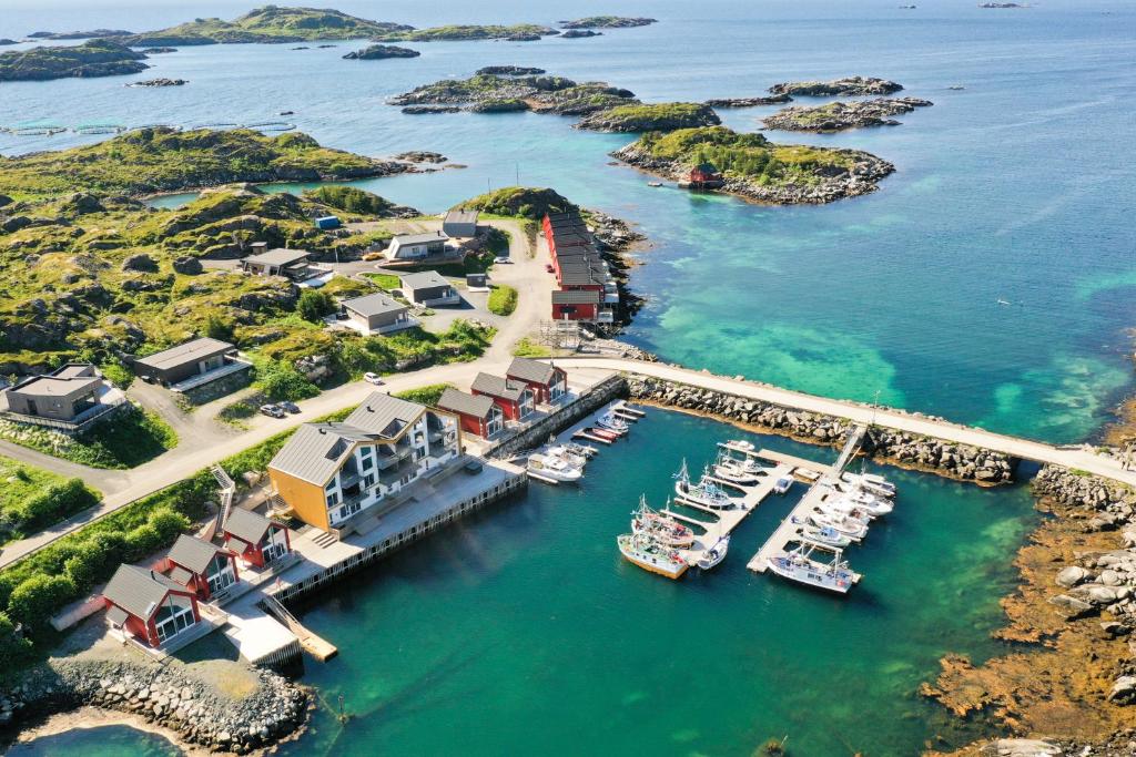 an aerial view of a marina with boats in the water at High standard Lodge Ballstad in Ballstad