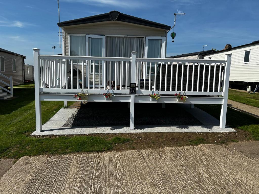 a white bench in front of a house at Drake 17 in Scarborough