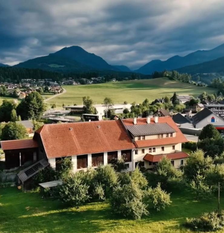 an aerial view of a building with mountains in the background at Biohof Fötschl in Tamsweg