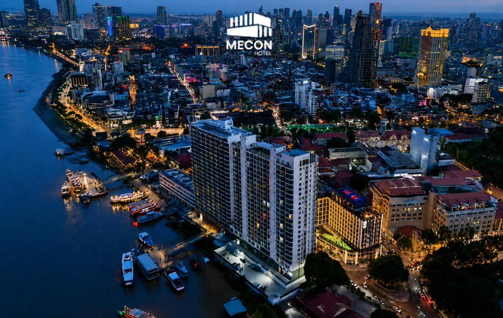 an aerial view of a city at night at Mecon Hotel in Phnom Penh