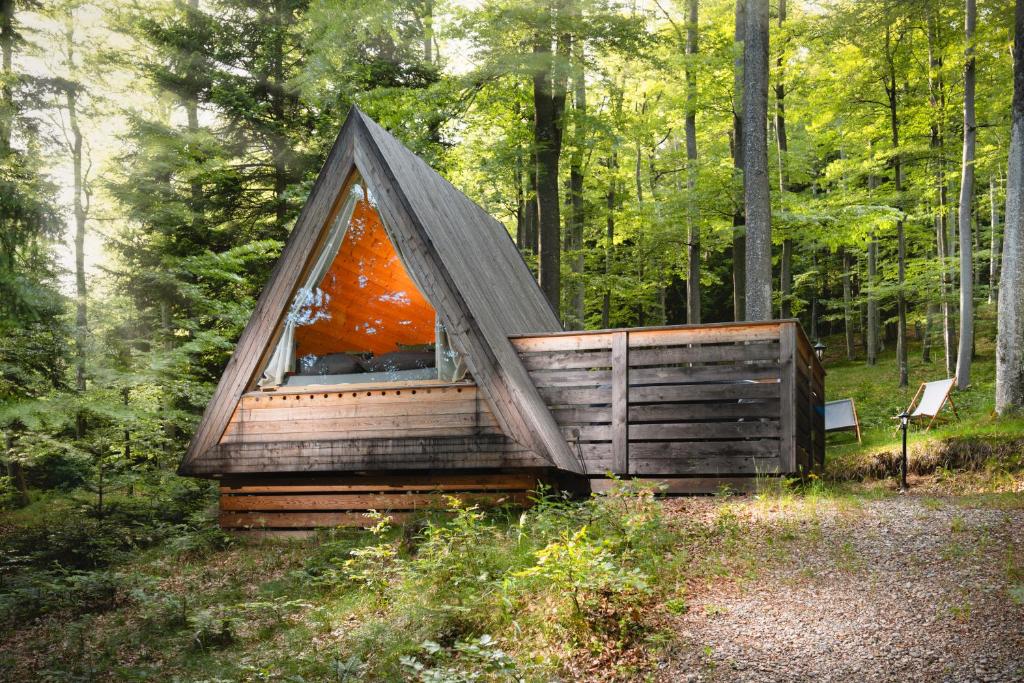 a tiny house in the middle of a forest at Nature's Nest - The Woods in Maribor