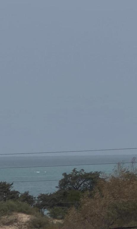 a view of the ocean from the top of a hill at Radi in Menzel Jemil