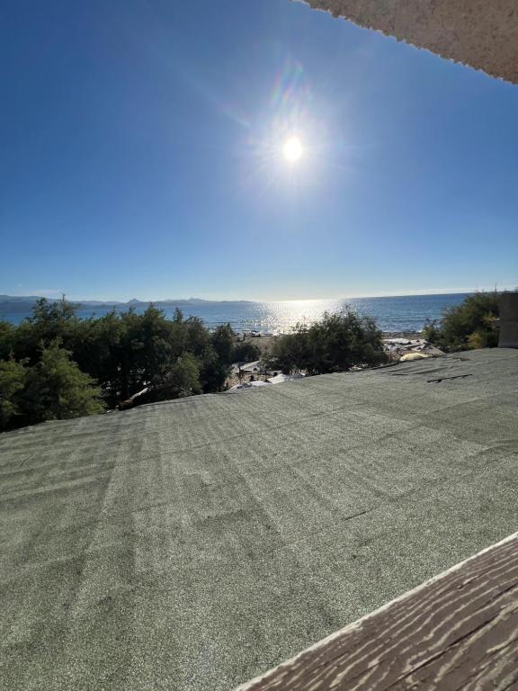 a view of a field with the sun in the sky at vue mer Studio 2/3 pers 1 bed + 1 cot in Farinole