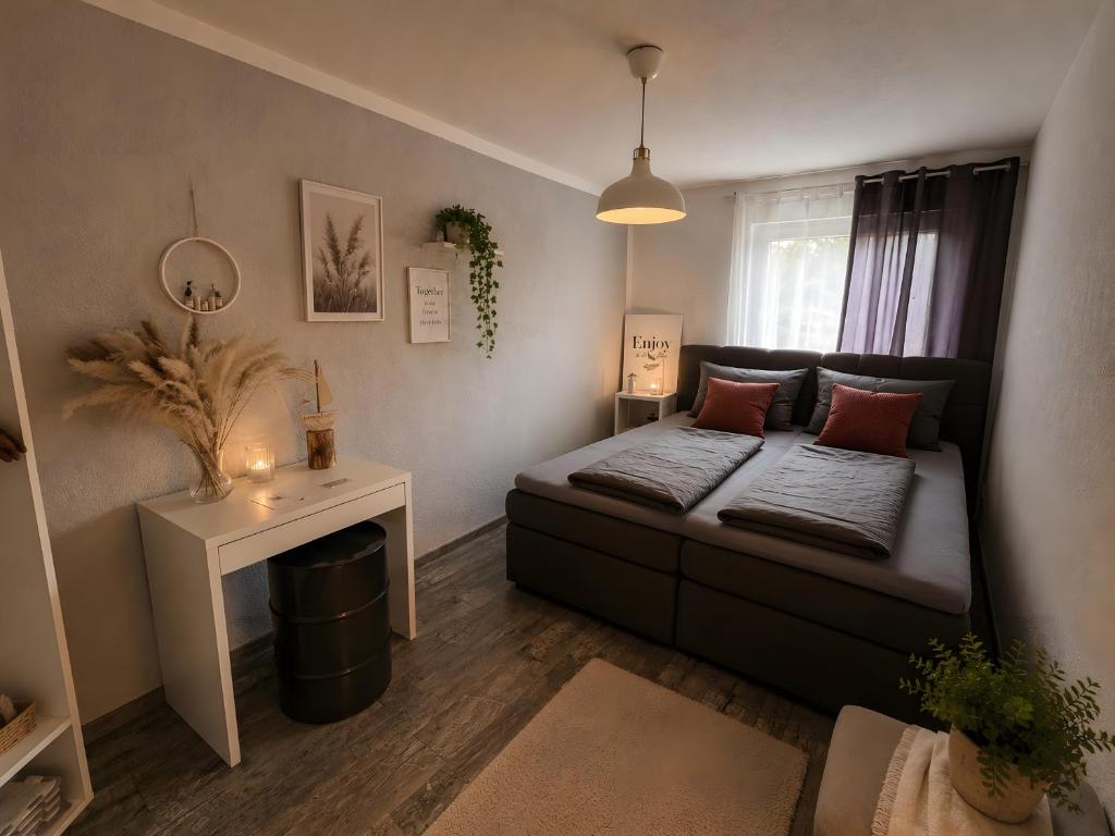 a small living room with a couch and a table at Fewo Lago di Costanza I in Friedrichshafen