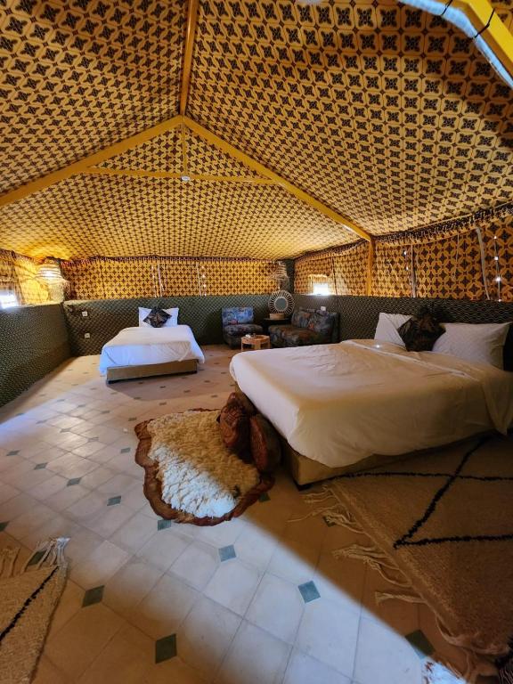 a bedroom with a large bed in a tent at Travel sky morocco camp in El Karia