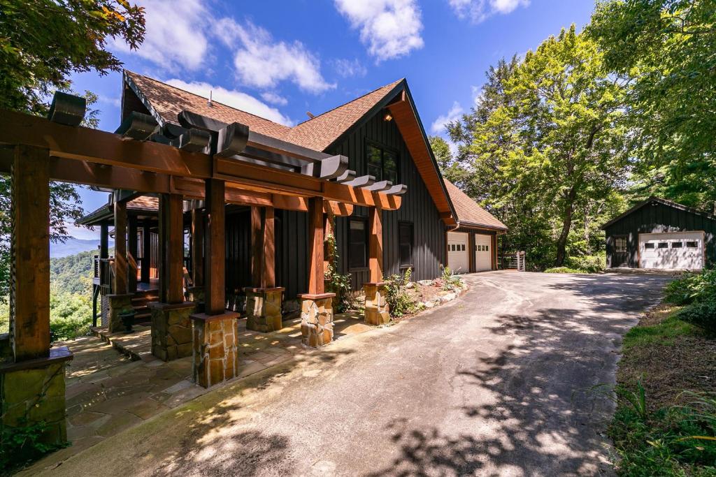 an exterior view of a house with a driveway at Rockcliff Retreat in Lenoir