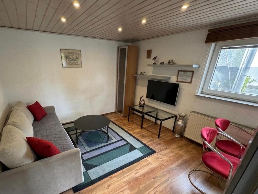 a living room with a couch and a tv at Hava 2 in Sarajevo