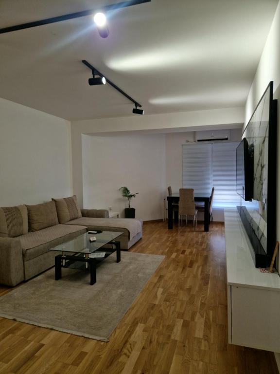 a living room with a couch and a table at Diamond Apartment in Strumica