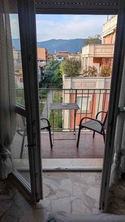 a view of a balcony with a table and chairs at ANDREA - Chiassi in Brescia