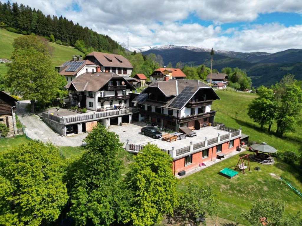 an aerial view of a large house in the mountains at Hansbauer Appartments in Gmünd in Kärnten
