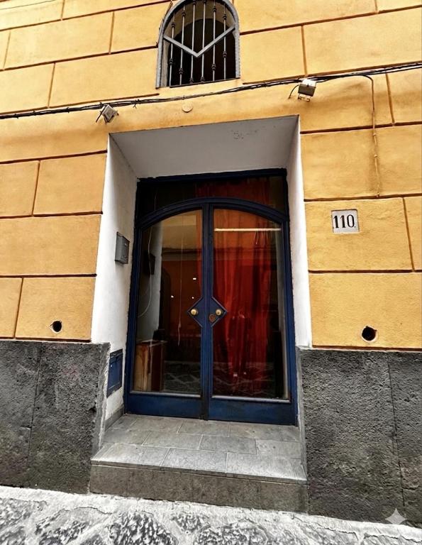 a door to a building with the number on it at Onda Blu House in Procida
